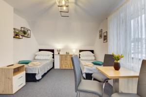 Postel nebo postele na pokoji v ubytování Apartament na wzgórzu + 26 fotografií