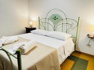 Un pat sau paturi într-o cameră la Mirodìa
