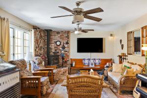 a living room filled with furniture and a flat screen tv at Netport Oasis in Arroyo Grande