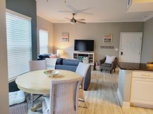 a living room with a couch and a table at Peaceful Seaside Condo-Walking Path to the Beach in Corpus Christi