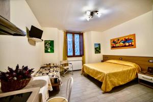 Postel nebo postele na pokoji v ubytování Residence Le stanze dei Visconti