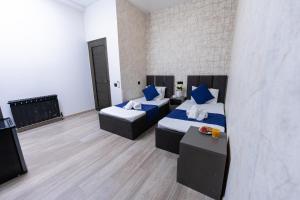 Postelja oz. postelje v sobi nastanitve Bloom Hotel Yerevan