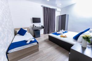 Postelja oz. postelje v sobi nastanitve Bloom Hotel Yerevan