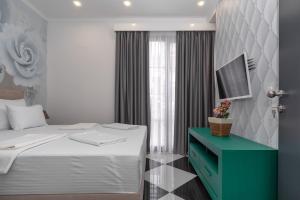 Voodi või voodid majutusasutuse Baba's Hotel & Spa toas