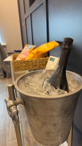 a bottle of champagne in a bucket of ice at The King's Parlour Whitehead in Whitehead