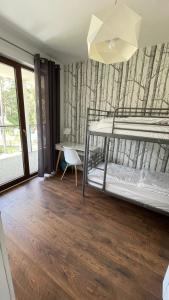 Posteľ alebo postele v izbe v ubytovaní Apartament nad jeziorem , ZEFIR