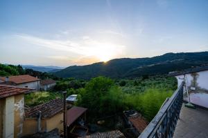 a view of the sunset from the balcony of a house at Casa Soleggiata in Mazzola