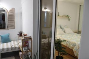 a bedroom with a bed and a mirror at Viewpoint Machico - Lovely Nature View in Machico +27 photos