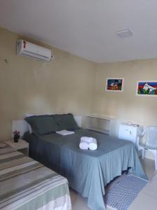 Katil atau katil-katil dalam bilik di Pousada Villa Manduca