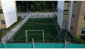 an aerial view of a soccer field in front of a building at Descanso y confort in La Tebaida