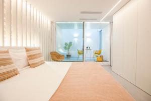 Posteľ alebo postele v izbe v ubytovaní Apartamentos Atia Catedral