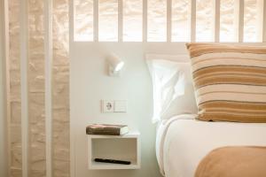 Posteľ alebo postele v izbe v ubytovaní Apartamentos Atia Catedral
