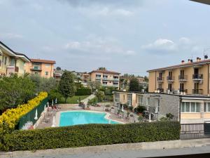 a view of a swimming pool from a apartment at Bardolino Lake Apartments in Bardolino
