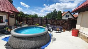 a hot tub in a swing in a backyard at BL Beskydy Lodge in Prostřední Bečva