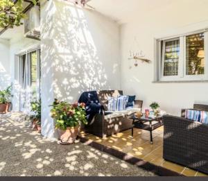 a living room with a couch and a table at Mare & Bartol in Bribir +37 photos