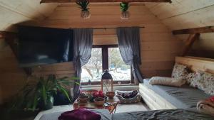 a room with a bed and a large window at BL Beskydy Lodge in Prostřední Bečva