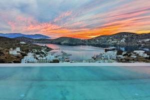 a view of a sunset from the roof of a building at Villa Mirabilis in Ios Chora