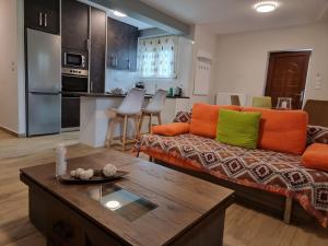 a living room with a couch and a table at CASA DI NIMA in Ioannina