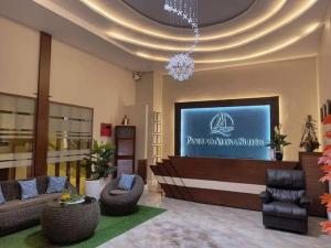 a lobby with a large screen in a building at Panglao Alona Suites in Taiwala