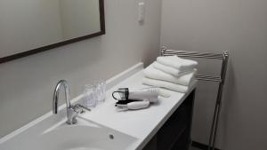 a bathroom with a sink and a mirror and towels at KAINOSATO - Vacation STAY 08807v in Azagawa