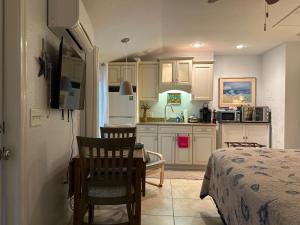 a kitchen with a table and chairs in a room at An Island Getaway at Palm Tree Villas in Holmes Beach