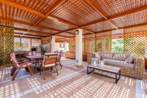 a living room with a couch and a table at Gold Crest Home in Drapanias beach, Nopigia in Kissamos