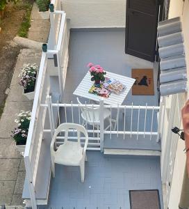 an overhead view of a patio with a table and chairs at Ninni Mondello House in Mondello