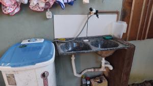 a dirty bathroom with a sink and a toilet at Casa aconchegante em alter in Alter do Chao +7 photos