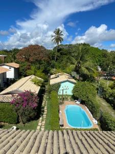 a view of the pool from the roof of a house at Casa Jasmim Imbassaí-BA in Mata de Sao Joao