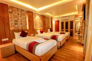 Voodi või voodid majutusasutuse Hotel Elegant Kathmandu Inn toas
