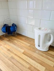 a kitchen with a fire extinguisher on the floor at Mia Property 2 in Bristol