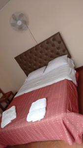 Giường trong phòng chung tại Hotel Aquarius