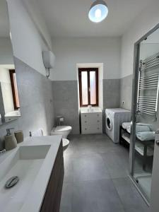 a bathroom with a sink and a toilet and a shower at Guest House Arya in Rome