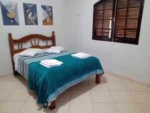 Postel nebo postele na pokoji v ubytování Pousada Chácara Amarela Entre a Natureza de Analândia + 194 fotografií