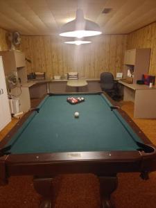 an office with a pool table in a room at Vinegar Hill Airbnb in Bridgetown