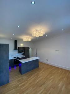 an empty room with a kitchen and a counter top at Luxury Apartment APT5 in Wolverhampton