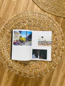 a photo album on top of a wicker basket at Bodega Sibeiro in Chantada