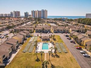an aerial view of a apartment complex with a pool at Sandcastles and Sunshine - Gulf Highlands Beach Resort in Panama City Beach