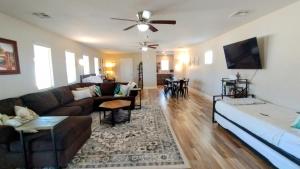 a living room with a couch and a table at Falcon Cottage in Pahrump