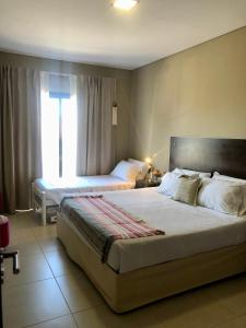 Giường trong phòng chung tại San Lorenzo Premium