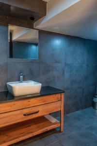 a bathroom with a sink on top of a counter at Eva Hotel in Antalya