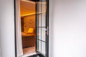 a sliding glass door leading to a room with a chair at Eva Hotel in Antalya