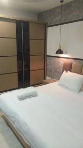 Ένα ή περισσότερα κρεβάτια σε δωμάτιο στο SUASANA MEL'S SUITE