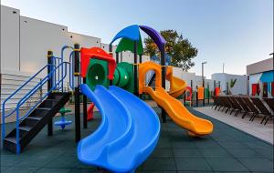 a playground with a slide and a slide at Resort em Olimpia in Olímpia