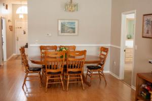 a dining room with a table and chairs at Florida Escape in Orlando