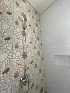 a shower in a bathroom with a shower at Villa Qfa Syariah in Lembang +21 photos