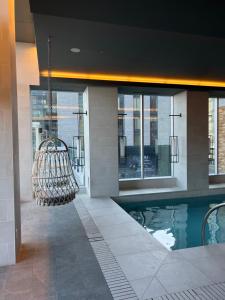 a swimming pool in the middle of a building at Beautiful one bedroom downtown Condo with pool and free parking in Montréal