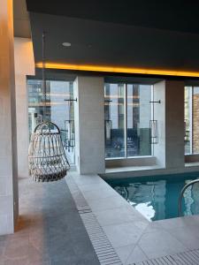 a swimming pool in the middle of a building at Beautiful one bedroom downtown Condo with pool and free parking in Montreal