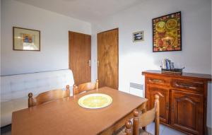 a kitchen with a wooden table with a plate on it at Lovely Apartment In Carcheto Brustico With Outdoor Swimming Pool in Carcheto