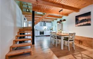 a kitchen and dining room with a table and chairs at Stunning Home In Varazdinske Toplice With Kitchenette in Varaždinske Toplice